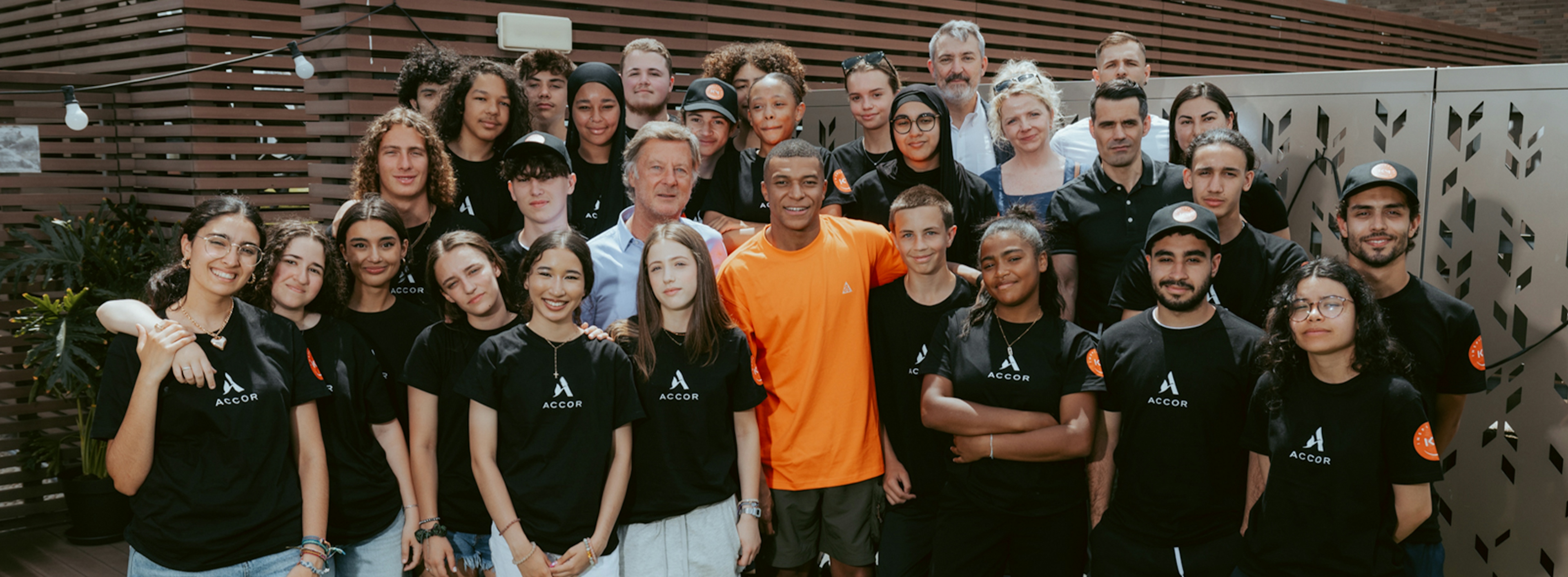 a groupe of youth with Kylian Mbappé